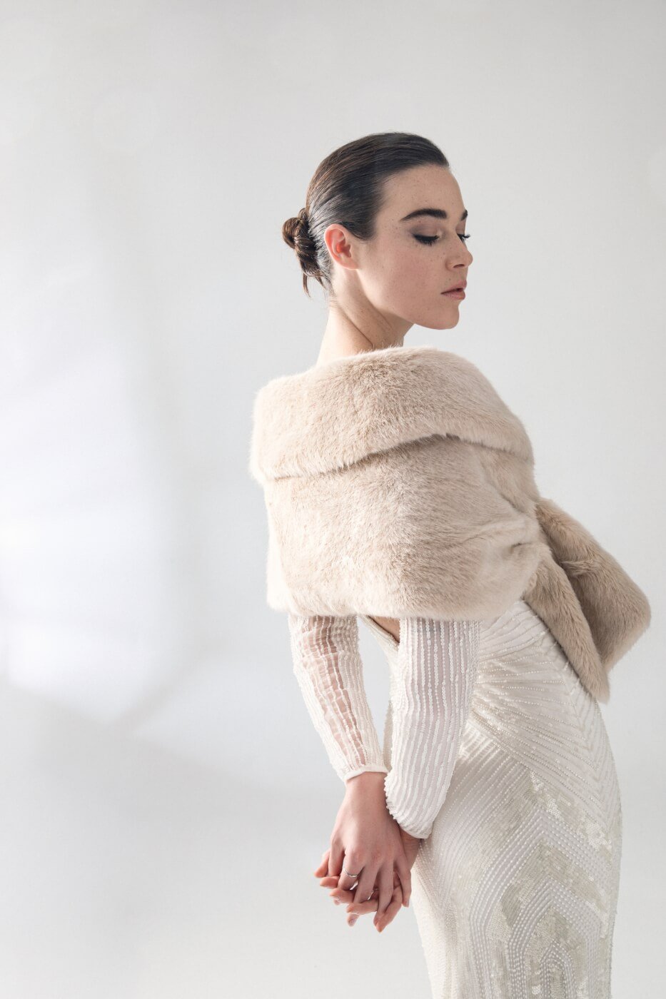 A woman models a vegan fur wrap