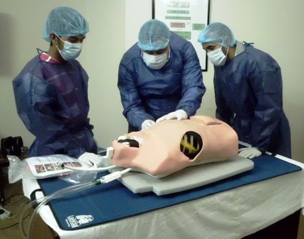surgeons-in-training using a TraumaMan human simulator