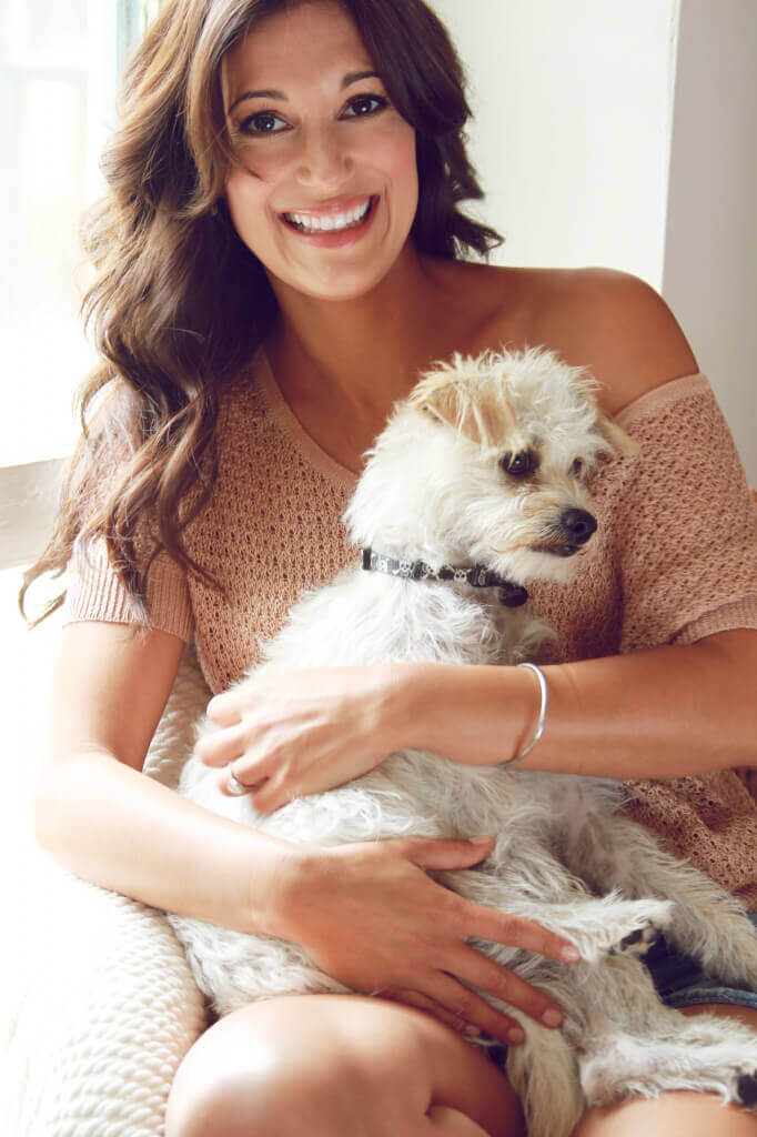 Angelique Cabral poses with her dog, Oscar.