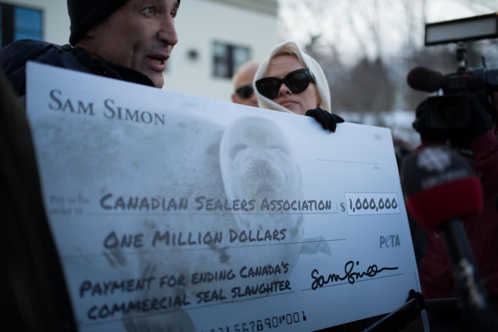 Sam Simon and Pamela Anderson with Million Dollar Check