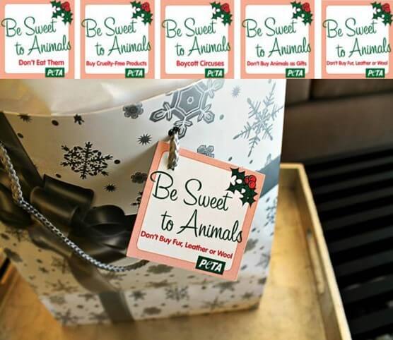 A white giftbag with snowflakes and a "Be Sweet to Animals" PETA gift tag