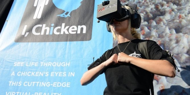 passerby experiencing PETA's virtual reality program called I, Chicken