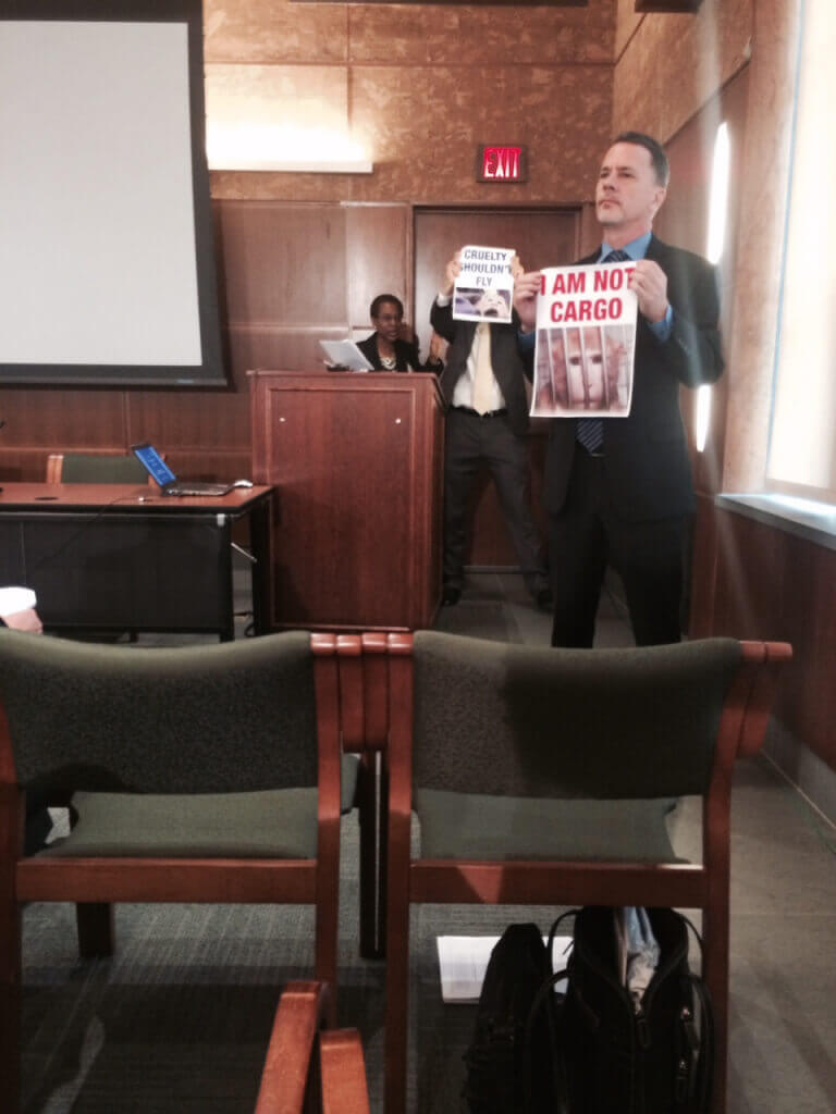 Protesters Disrupt Experimenter Meeting