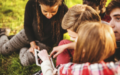 college students outside studying