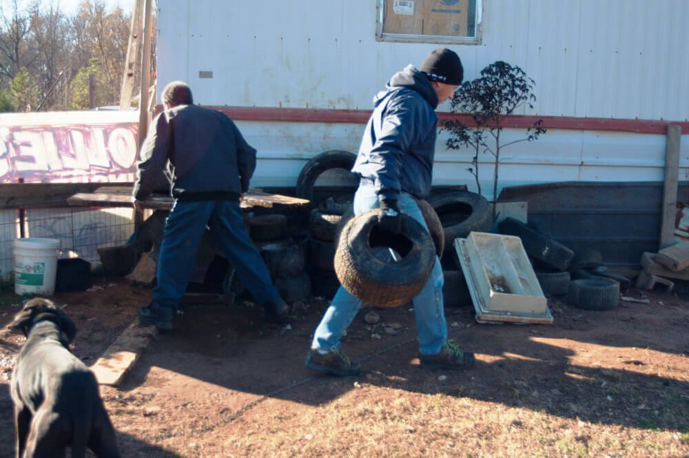 PETA Volunteers Delivering Doghouses to Chained Dog