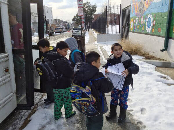 Kids Getting on Bus with PETA Circus Activity Books