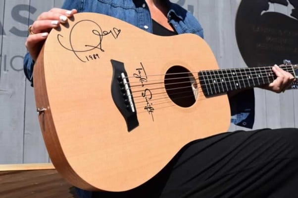 Baby Taylor guitar signed by Taylor Swift