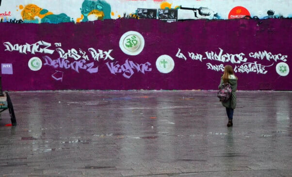 A PETA France mural in Paris after violence that swept the city earlier this year, featuring religious symbols drawn in peas and the words, "Give Peas a Chance – Go Vegan. Non-Violence Begins on Our Plates."