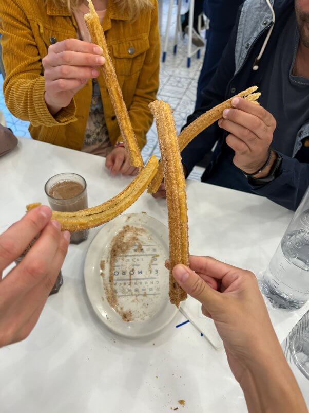 people holding vegan churros from churreria el moro in mexico city