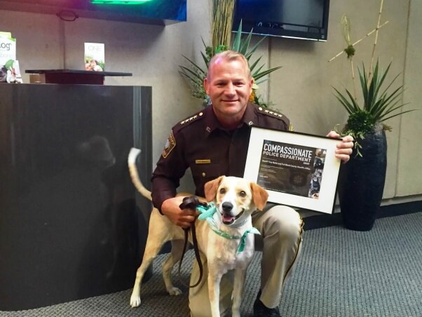 Sheriff and Archer with award