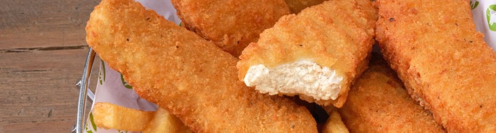 a basket of beyond meat's vegan chicken tenders with french fries