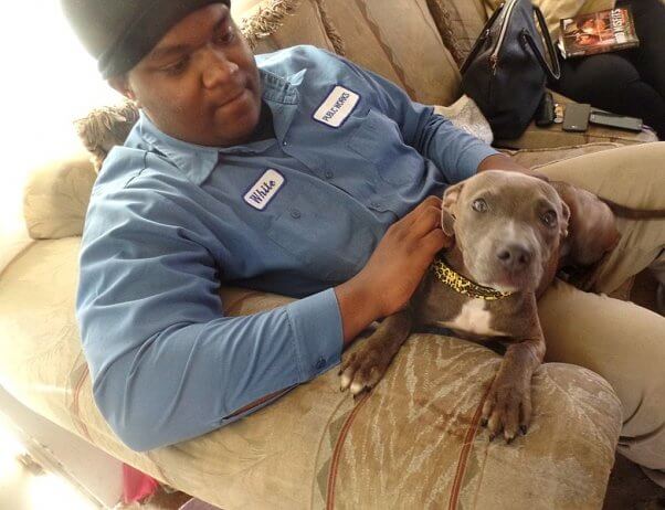 Puppy and man sitting on couch