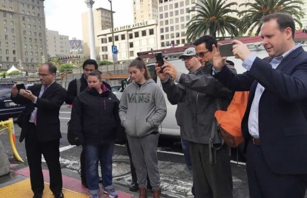 Body-painted "reptiles" outside Louis Vuitton San Francisco store