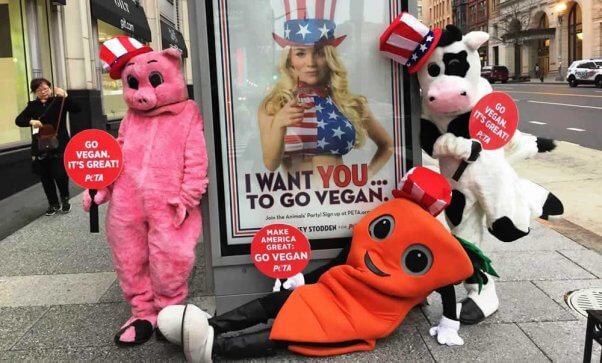 PETA mascots posing with Courtney Stodden ads in DC