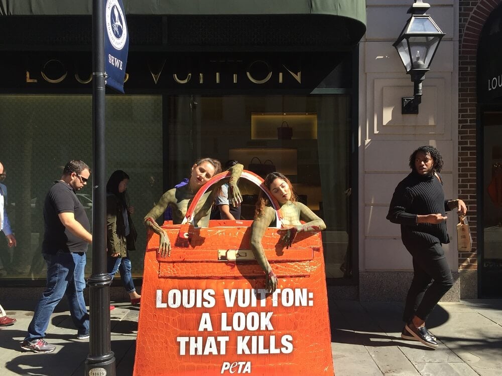 Passers-By Gasp at Naked &#39;Crocodiles&#39; Outside Louis Vuitton Store | PETA