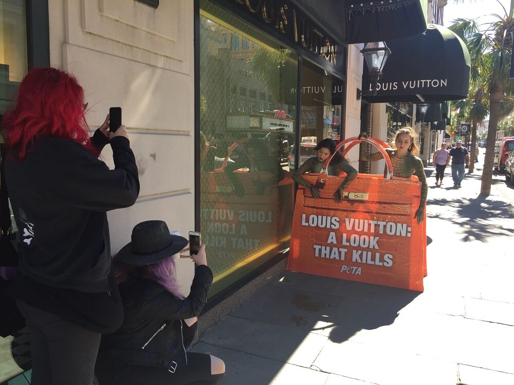 Passers-By Gasp at Naked &#39;Crocodiles&#39; Outside Louis Vuitton Store | PETA