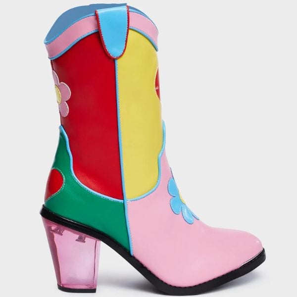 a colorblocked western-inspired boot with flowers and a transparent heel