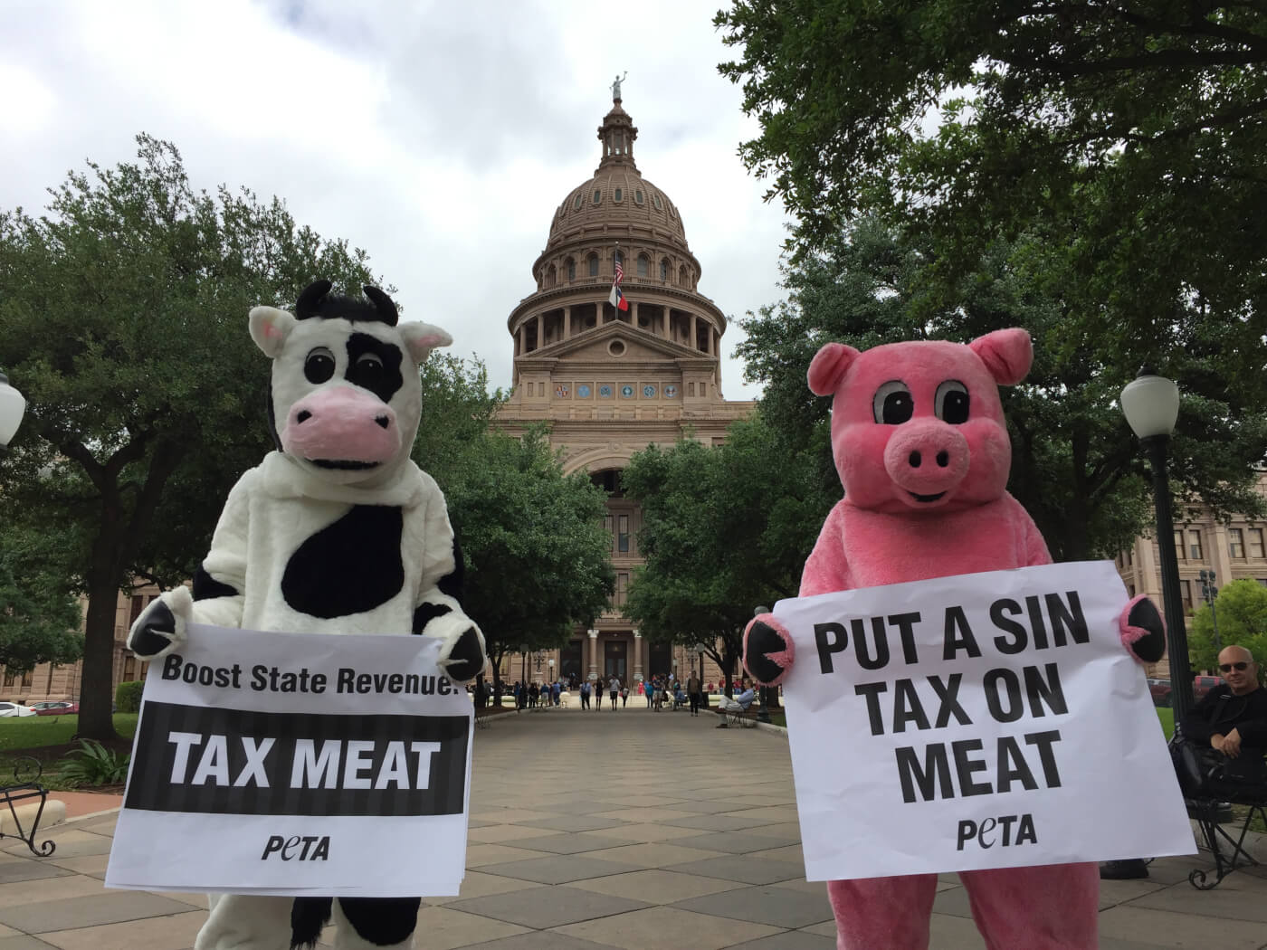 On Tax Day, 'Pigs' and 'Cows' Demand 'Tax Meat' PETA