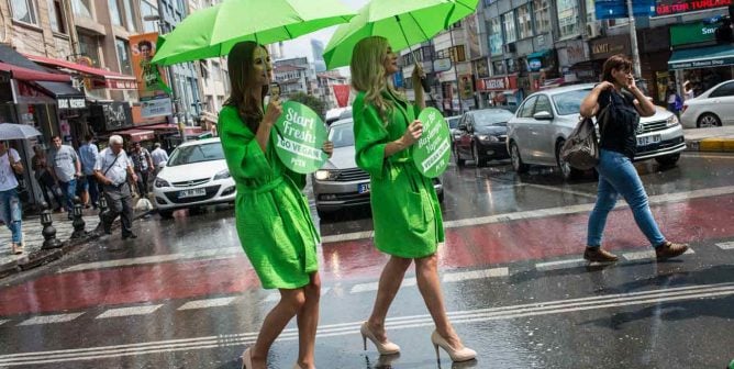 the Lettuce Ladies are a vision in green as they make their way through rainy Istanbul