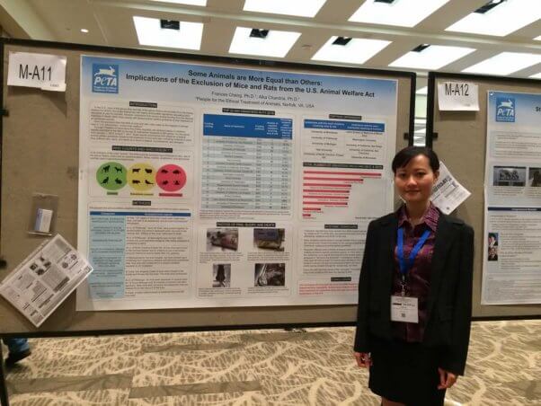 Dr. Frances Cheng in front of her poster presentation at international conference