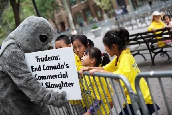 PETA seal with cute kids at UN building