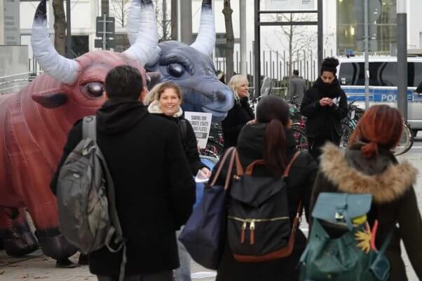 PETA supporters interacting with crowd of people