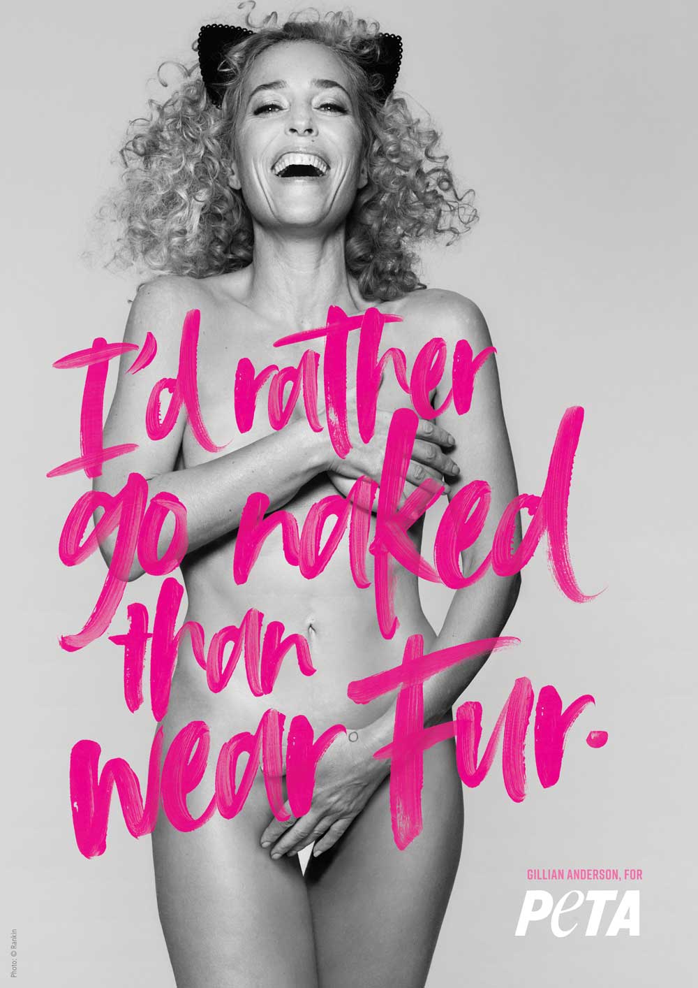 Gillian Anderson posing nude with pink writing that says "I