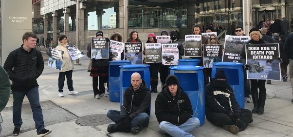 chrysler protest, chained dogs