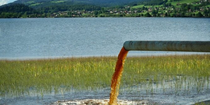 pipe dumping pollution into freshwater