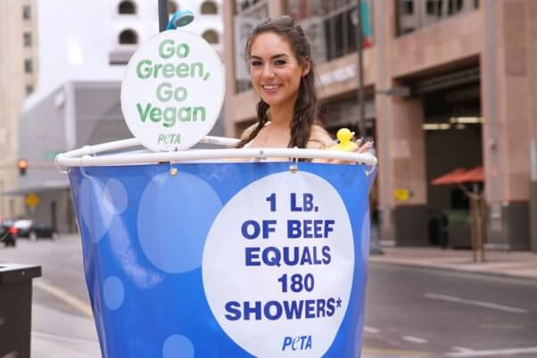 peta earth day demo - activists shower in public across the U.S.