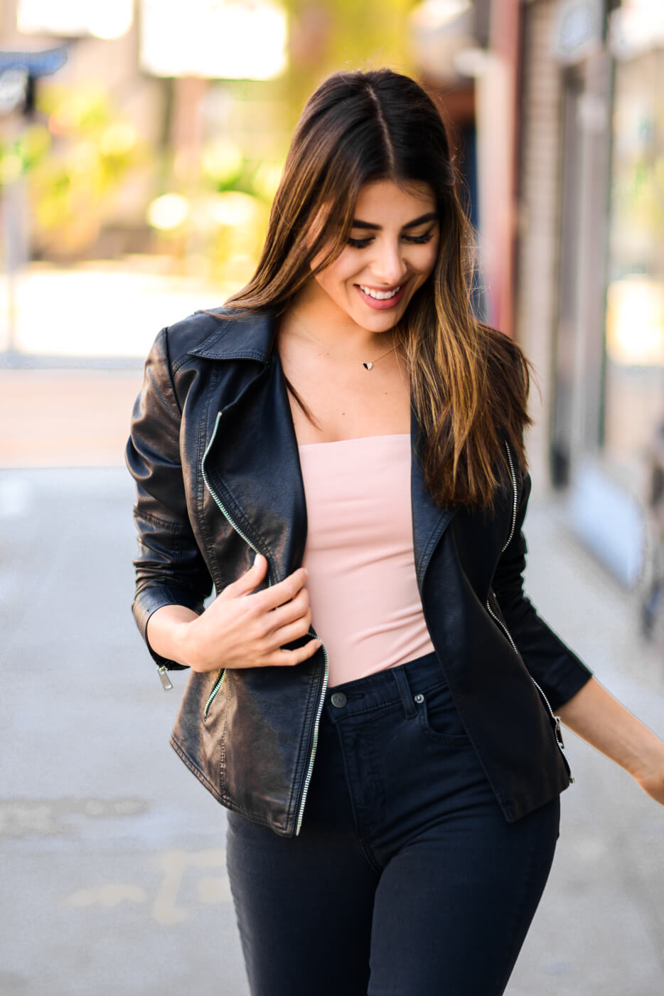 Woman modeling the PETA Coalition LA faux leather jacket