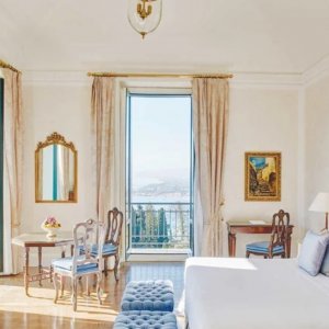 a bright white room with light blue accents in a hotel