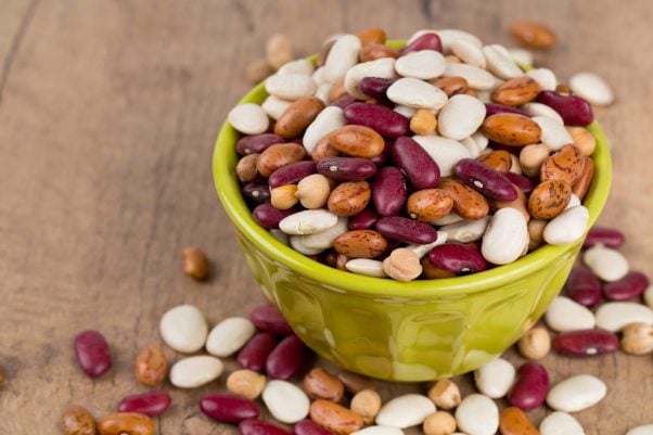 Small green bowl with several types of beans