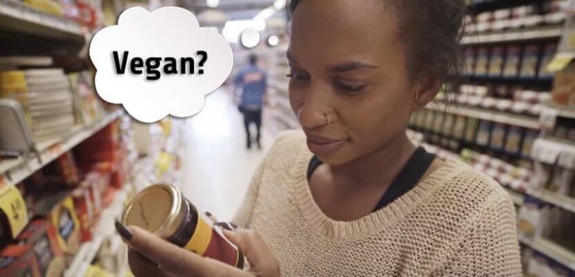 person shopping and looking at a label for the word