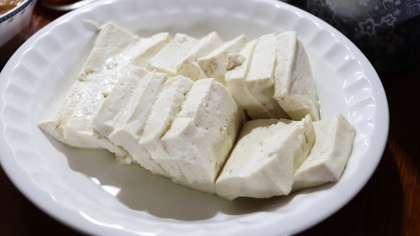Sliced tofu on a white plate