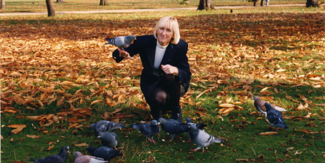 Ingrid Newkirk IEN in park with birds