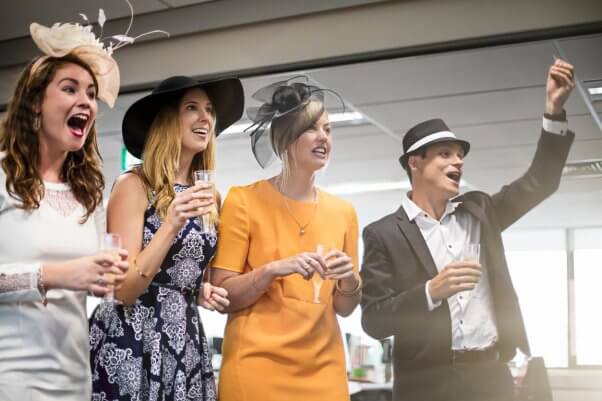 people watching horse race, horse racing, feather hats