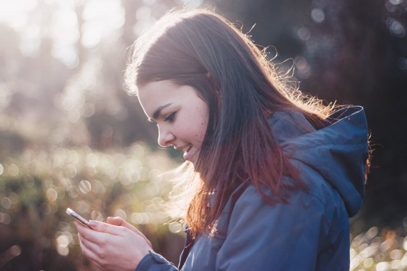 youth texting phone