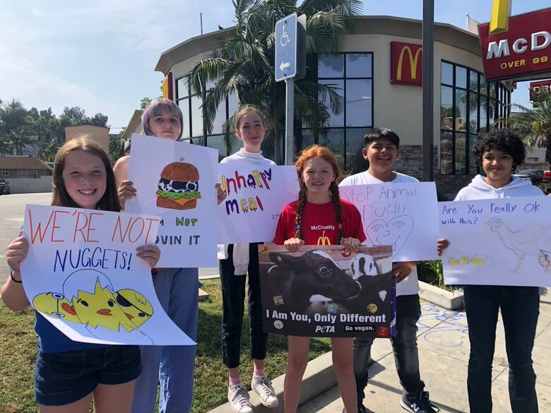 teenagers protesting at mcdonalds