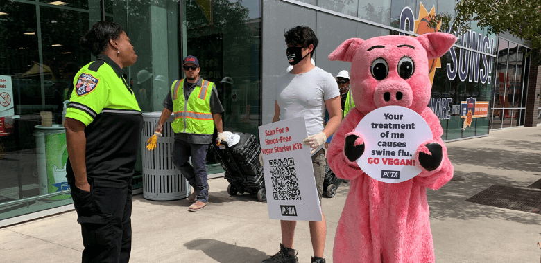 "Pandemic Pig" and PETA protester in Phoenix