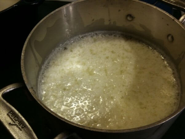 curds and whey in a steel pot