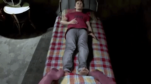 humanoid pig tucking human into bed in human farm video game
