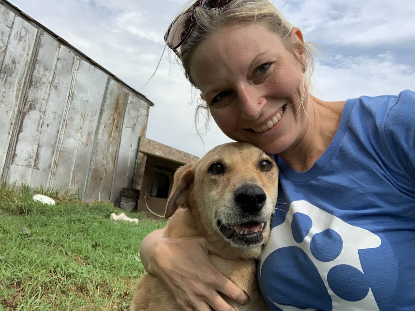 Woman posing with dog in a selfie