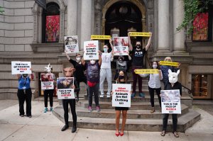 Protestors stand on the streets outside Urban Outfitters to protest use of animal products