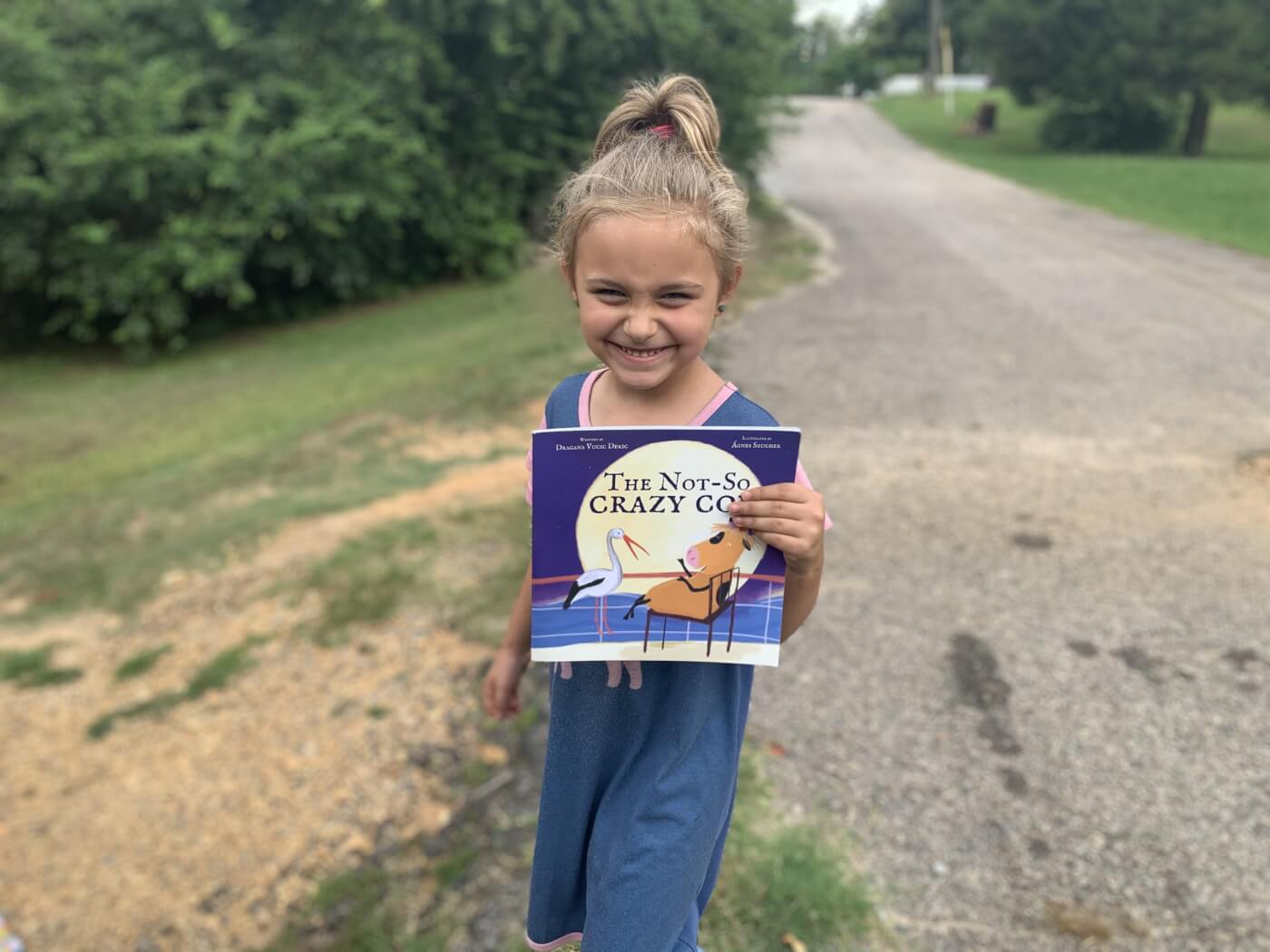 Kid with animal-friendly book from PETA