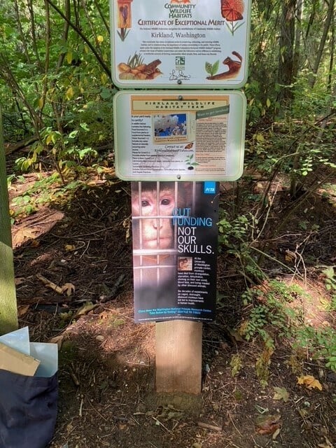 Poster calling for an end to funding for uw primate center