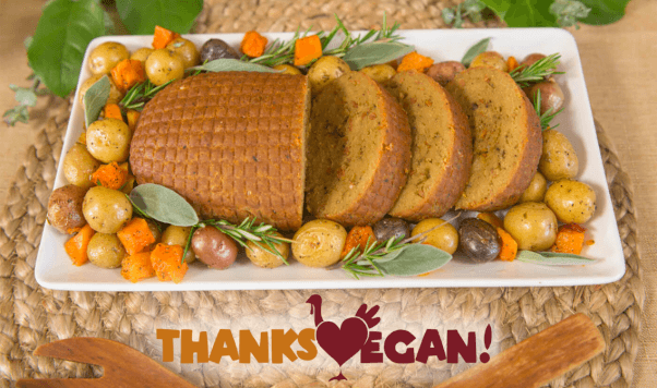 Thanksvegan logo with vegan roast and potatoes on a plate