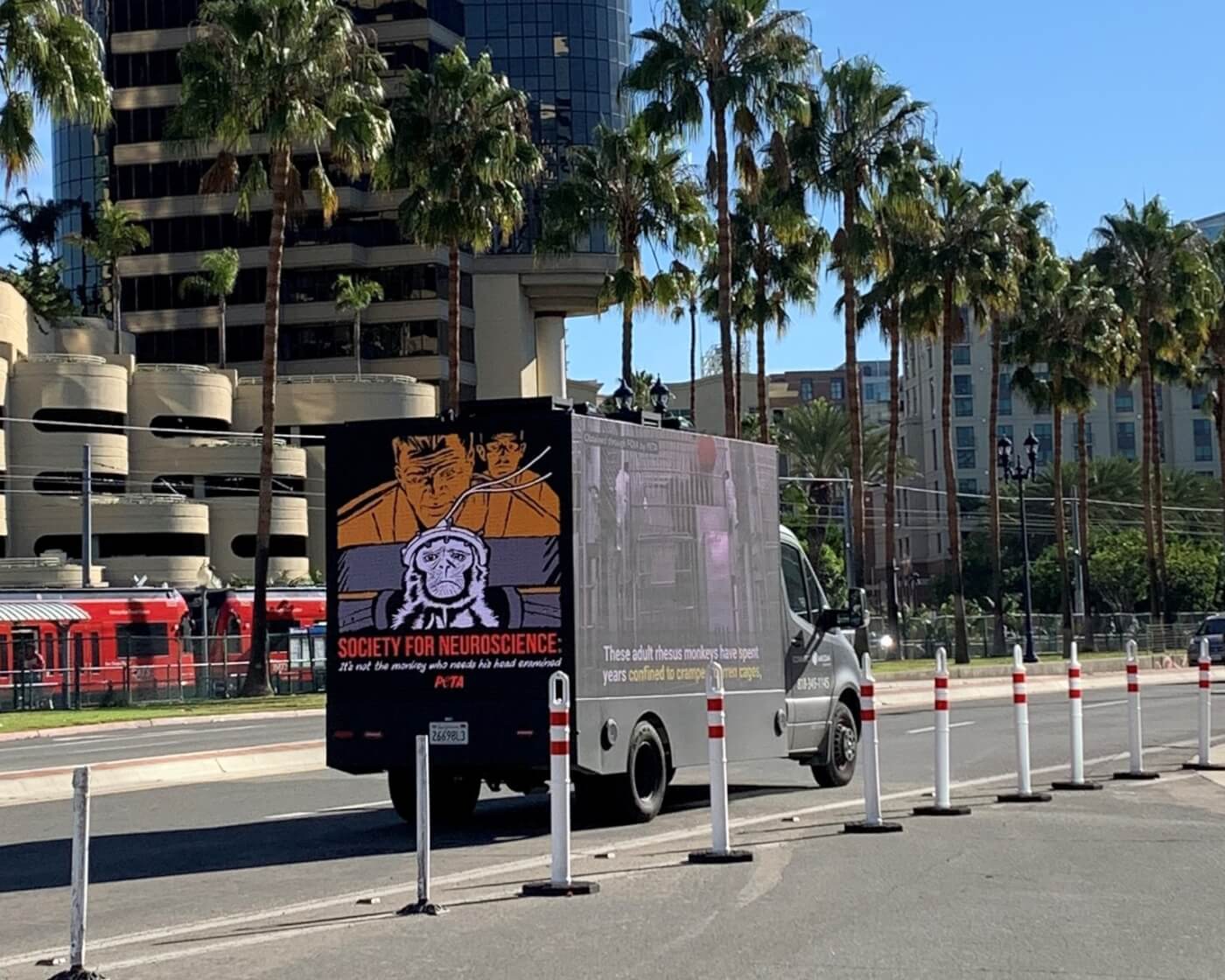 PETA's WaNPRC mobile billboard drives through a neuroscience conference