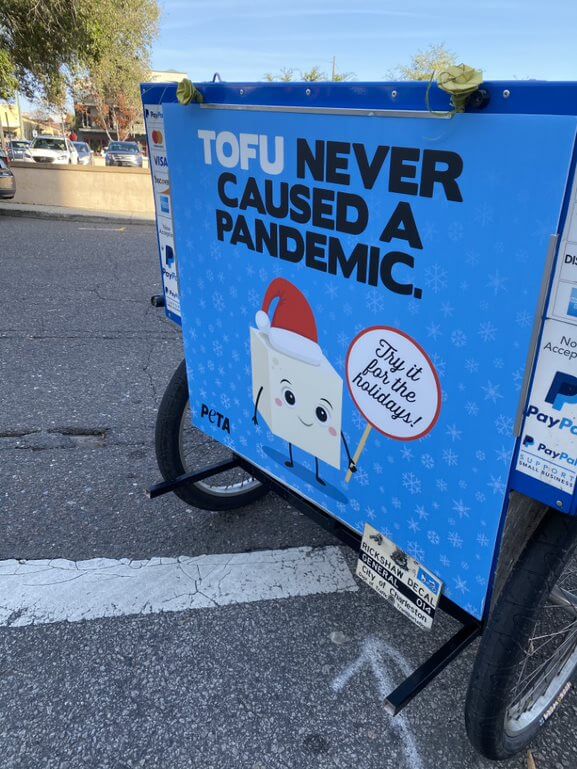 'Tofu Never Caused a Pandemic' on a rickshaw in Charleston, South Carolina