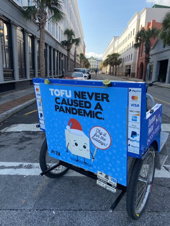 'Tofu Never Caused a Pandemic' on a rickshaw in Charleston, South Carolina